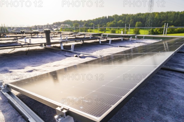Wide view of solar modules being installed on a roof, PV assembly, commercial customers, new build, Pforzheim, Germany