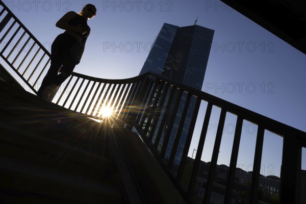 The sun sets behind the European Central Bank (ECB) in Frankfurt am Main, Frankfurt am Main, Hesse, Germany