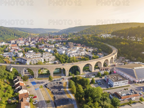 Large viaduct in a town, framed by hills and evening atmosphere, Nagold, district of Calw, Black Forest, Germany