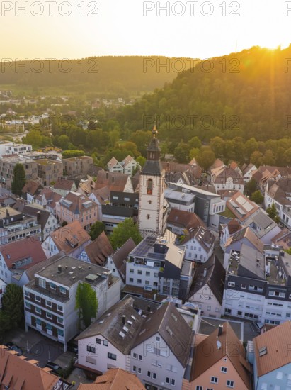 Bird's eye view of an urban area with church tower and hills in the evening light, Nagold, district of Calw, Black Forest, Germany