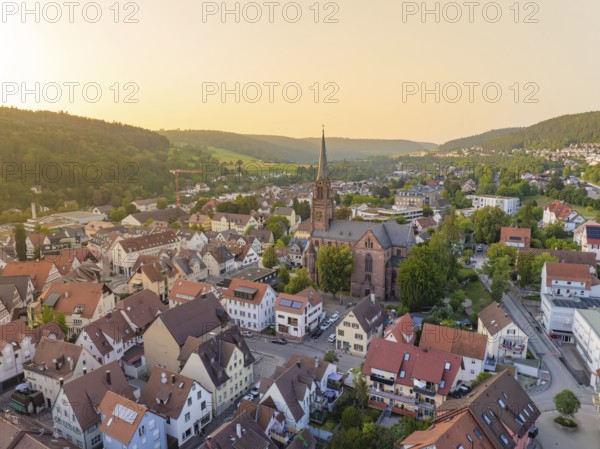 Panorama of an urban village with church and green hills in the evening light, Nagold, district of Calw, Black Forest, Germany