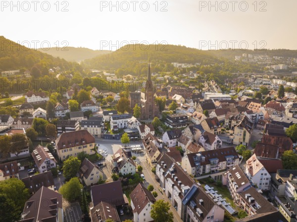 Town panorama with church and numerous houses in a village surrounded by forest, Nagold, district of Calw, Black Forest, Germany