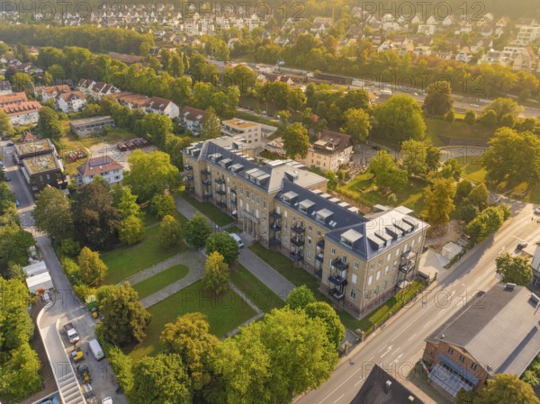 Residential building in urban neighbourhood, surrounded by autumnal trees and streets, Nagold, district of Calw, Black Forest, Germany