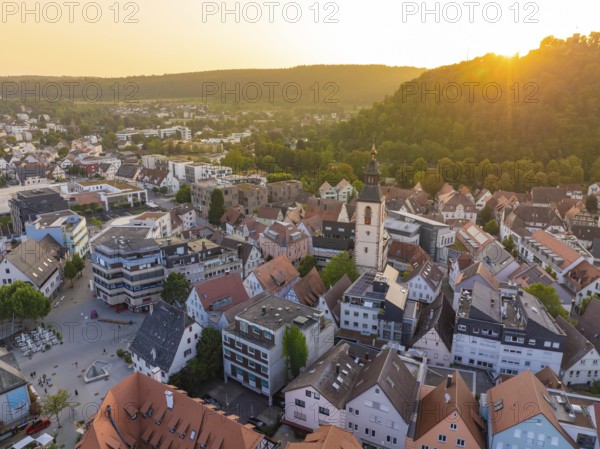 Evening view of an old town with church tower, surrounded by nature and hills, Nagold, district of Calw, Black Forest, Germany