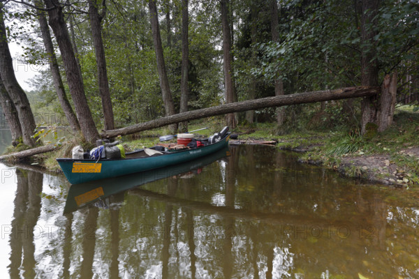 Canoe by nature photographers in Drosedower Bek, Müritz National Park, Mecklenburg-Western Pomerania, Germany