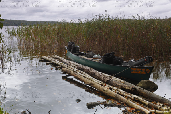 Canoe by nature photographers at Lake Rätzsee, Müritz National Park, Mecklenburg-Western Pomerania, Germany