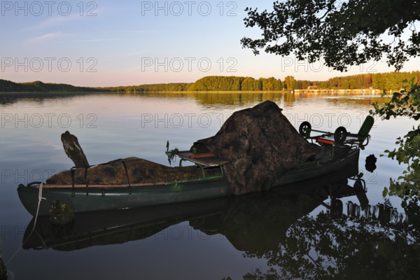 Kayak of a nature photographer in the water, Müritz National Park, Mecklenburg-Western Pomerania, Germany