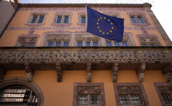 European flag flies at the town hall, Hôtel de Ville, market square, old town, Obernai, also Oberehnheim, Bas-Rhin, Grand-Est, Alsace, France