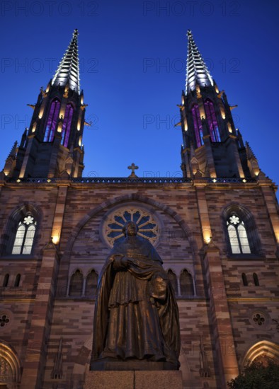 Monument, statue of Charles Emile Freppel, theologian and bishop of Angers, in front of the church Église Saints Pierre et Paul, St. Peter et St. Paul, old town, Obernai, also Oberehnheim, blue hour, dusk, Bas-Rhin, Grand-Est, Alsace, France