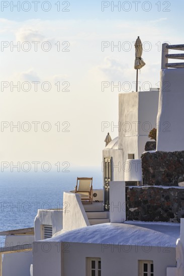 Sun lounger on terrace, holiday home with sea view, evening light, Oia, Thira, Santorini, Cyclades, Greece