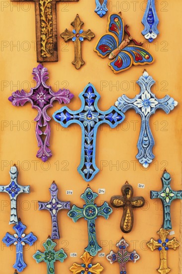 Orthodox crosses in different colours, typical souvenir shop in the old town, Oia, Thira, Santorini, Cyclades, Greece