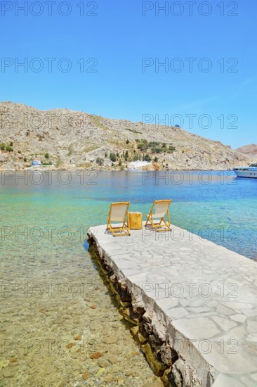 Path leading to the turquoise waters of Nimborio Beach, Nimborio, Symi Island, Dodecanese Islands, Greece