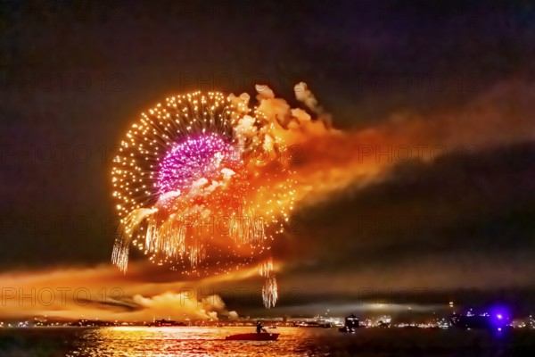 Lake Night Festival Constance. Water fireworks over the German shore and the neighbouring Swiss town of Kreuzlingen. View of the fireworks from Lake Constance. Constance, Baden-Württemberg, Germany