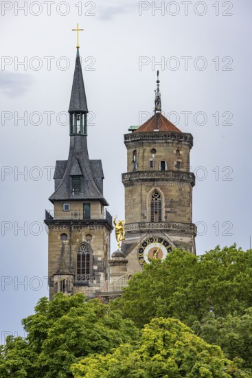 City view of Stuttgart with the two towers of the collegiate church. In between, the Mercury Column with the gilded figure of Mercury. Stuttgart, Baden-Württemberg, Germany