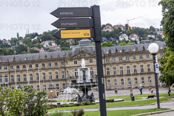 Digital signpost in front of the New Palace on Schlossplatz in Stuttgart. Regularly changing LED displays indicate cultural events, the arrows point in the direction of the event. Stuttgart, Baden-Württemberg, Germany