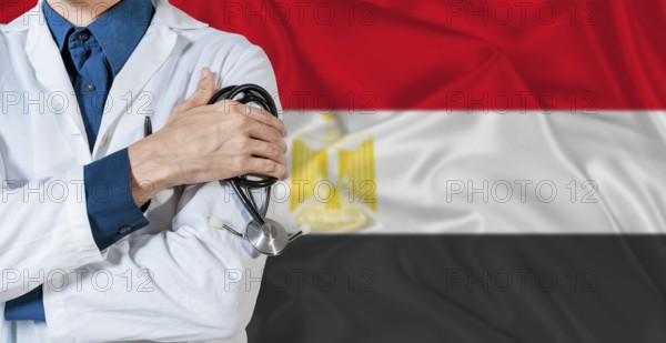 Doctor with stethoscope on Egypt flag. Doctor holding stethoscope on Egypt flag
