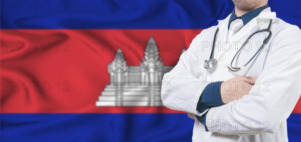Cambodia healthcare concept. Male doctor on Cambodia flag. Doctor with crossed arms on Cambodia flag