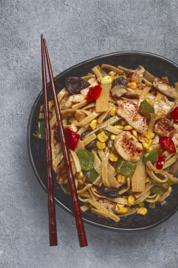 Fried noodles with chicken meat and vegetables, Bami Goreng, Indonesian dish, no people
