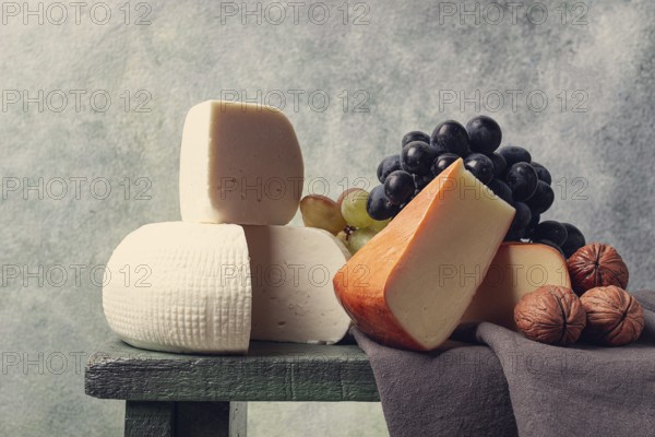 Georgian cheese, Imeretian and smoked suluguni, grapes, nuts, on a cutting board, Georgian cuisine, no people