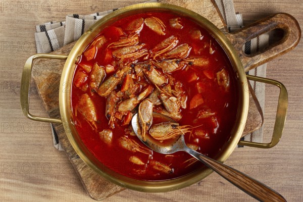 French shrimp bisque soup, in a pot, close-up, no people