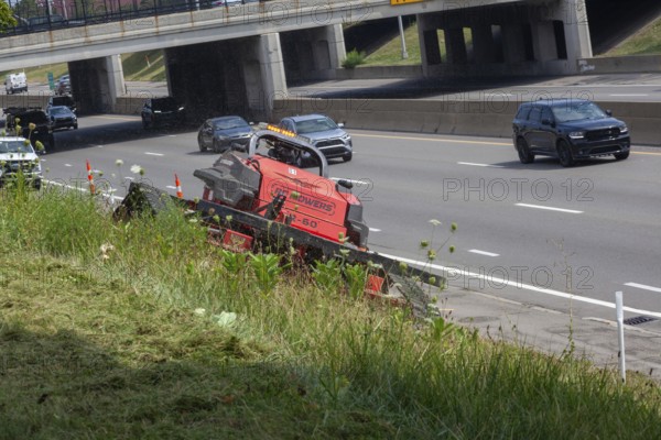 Harper Woods, Michigan - Remote-control mowers are cutting the grass and weeds along Interstate 94 and other freeways running through Detroit. The machines are said to be safer when operating on the steep embankments along most of the city's freeways