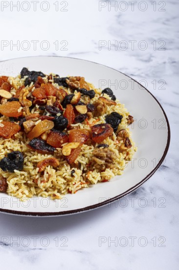 Rice dish, with the addition of dried fruits, nuts and spices of Middle Eastern cuisine, homemade, no people