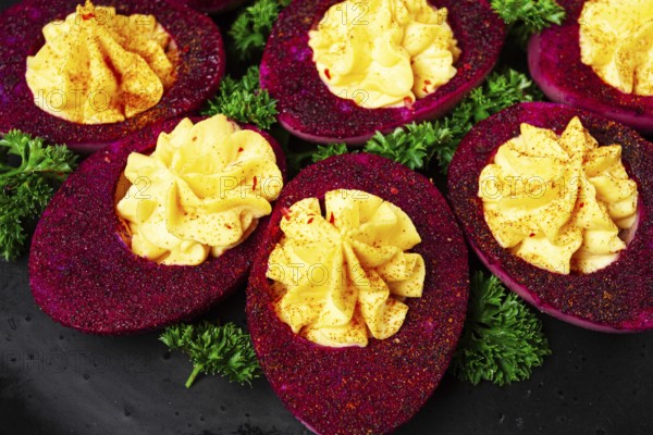 Stuffed eggs, stained with beetroot juice, purple, pitaya powder, top view, top view, close-up, no people