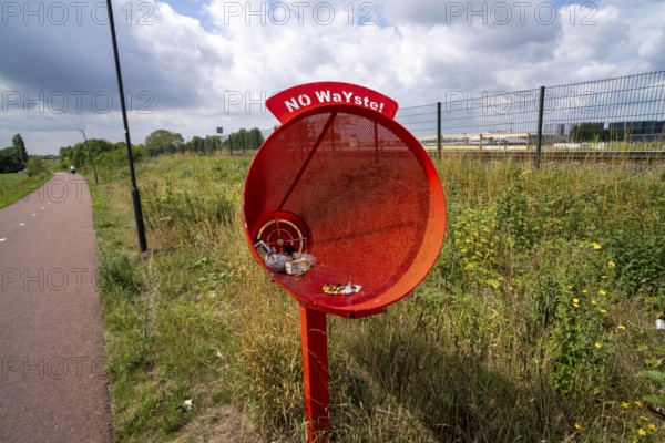 Cycle path near Katwijk, North Brabant, on the river Maas, rubbish bin for cyclists, funnel-shaped, so that you can throw your rubbish in while cycling, Netherlands
