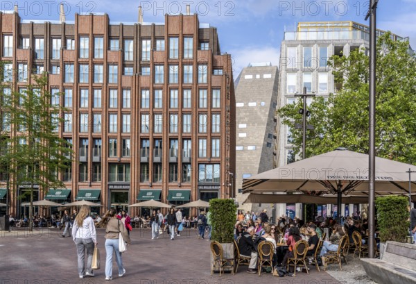 The Grote Markt in the old town of Groningen, modern facades of hotel and commercial buildings, in the centre the Forum Groningen, gastronomy, Netherlands