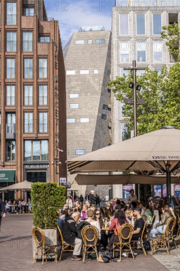 The Grote Markt in the old town of Groningen, modern facades of hotel and commercial buildings, in the centre the Forum Groningen, gastronomy, Netherlands