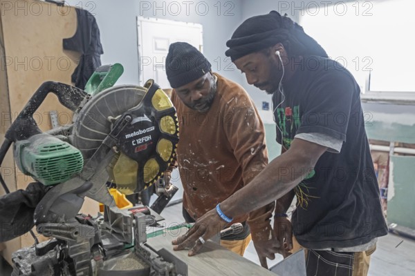 Detroit, Michigan - Workers remodel a house in the Morningside neighborhood that had been vacant for many years. Detroit lost nearly two-thirds of its residents from 1950 to 2020 but has been growing modestly in recent years