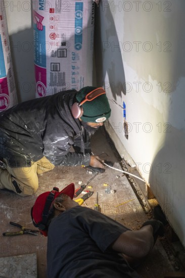 Detroit, Michigan - Workers remodel a house in the Morningside neighborhood that had been vacant for many years. Detroit lost nearly two-thirds of its residents from 1950 to 2020 but has been growing modestly in recent years