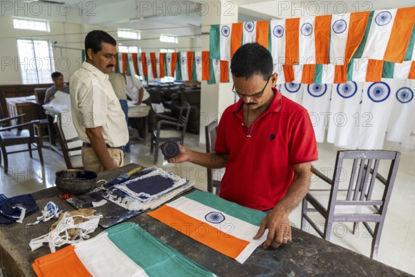 Employees of the Assam Khadi and Village Industries Board working in a manufacturing unit of Indian National Flag, ahead of 79th Independence Day, in Guwahati, India on 11 August 2025
