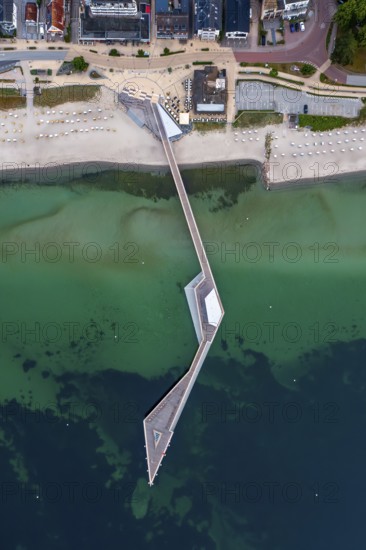 Aerial view over Seebrücke, pier and sandy beach at seaside resort Haffkrug along the Baltic Sea, Scharbeutz, Schleswig-Holstein, Germany