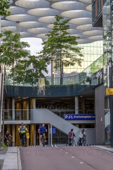 Entrance and exit to the central bicycle car park at Stationsplein, the largest bicycle car park in the world with over 13, 000 parking spaces on 3 floors, directly under the central station, Utrecht Centraal, Netherlands