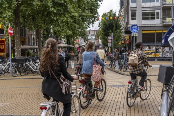 Cycling in the city centre of Groningen, old town, Netherlands
