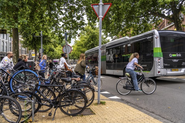 Ride your bike in the city centre of Groningen, old town, designated areas where bikes may be parked, bikes parked outside will be removed, Netherlands