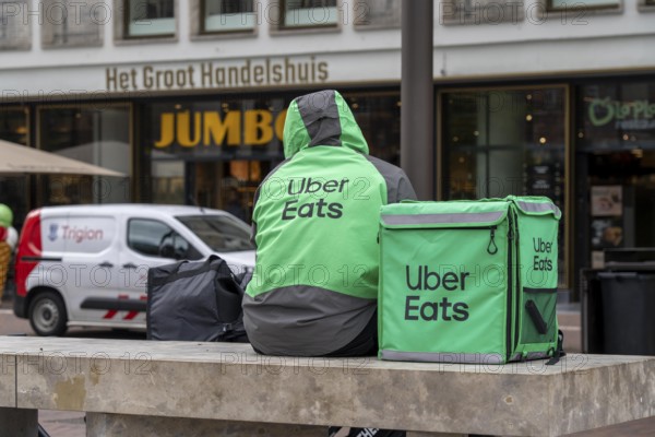 Bicycle transport in Groningen, Uber Eats, courier driver waiting for new orders, Netherlands