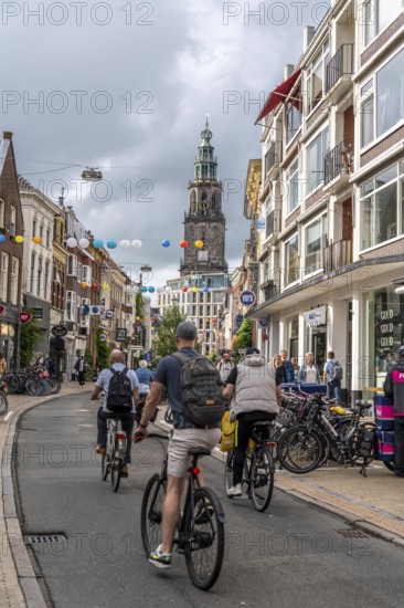 Cycling in the city centre of Groningen, old town, Netherlands
