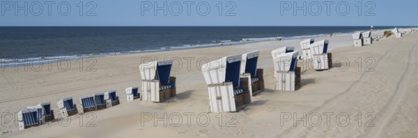 Germany, Schleswig-Holstein, North Frisia, Sylt, Westerlandt, Beach chairs on the sandy beach