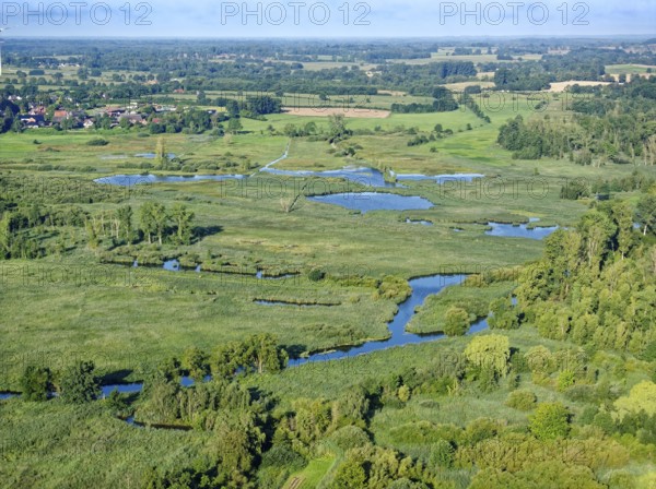 Water surfaces of the Trave and vegetation in the Brenner Moor. Aerial view. The Brenner Moor is a salt marsh, FFH area, in the Trave lowlands near Bad Oldesloe. Schleswig-Holstein, Germany