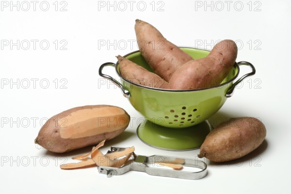 Sweet potato with potato peeler, Ipomoea batatas