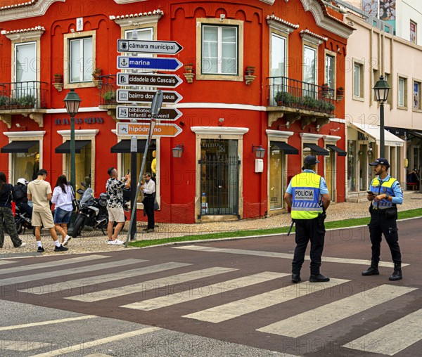 Police officers in uniform on the streets in the resort town of Cascais, Portugal