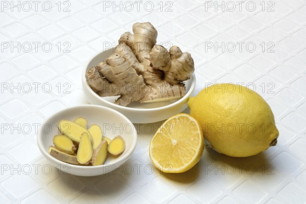 Ginger, ginger tubers and ginger slices in peel, lemon