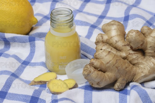 Ginger root, lemon and ginger shot