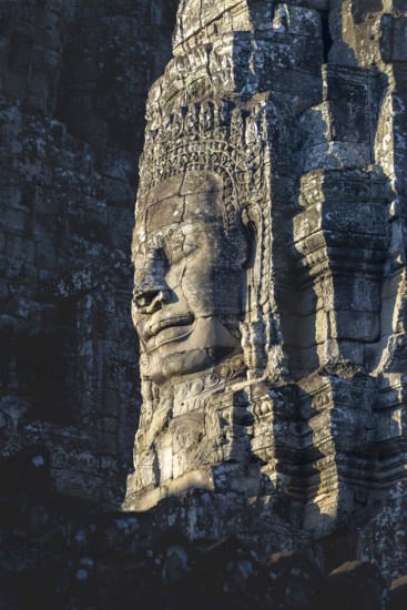Huge stone-carved face of Bodhisattva Lokeshvara, also Avalokiteshvara, Bayon Temple, Angkor Thom, UNESCO World Heritage Site, Angkor Wat, Siem Reap, Cambodia