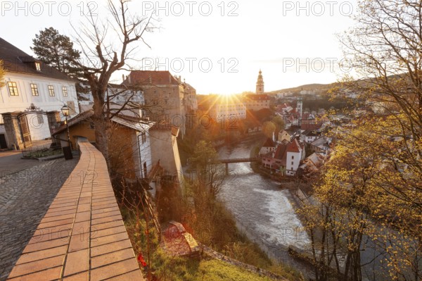 Spring morning sunrise with castle view over the rooftops of Krumlov in southern Bohemia, Czech Republic
