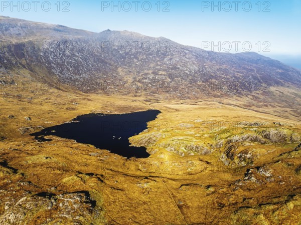 Autumn colours over Llyn Cwmffynnon and Miner's Track, Start Point, road A4086 from a drone, Pen-y-Pass, Snowdonia, Wales, UK