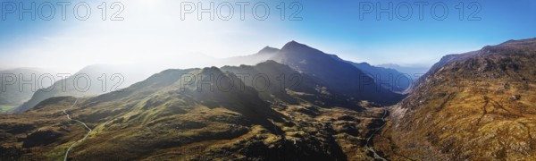Autumn colours of Pen-y-Pass over Miner's Track, Start Point and road A4086 from a drone, Snowdonia, Wales, UK
