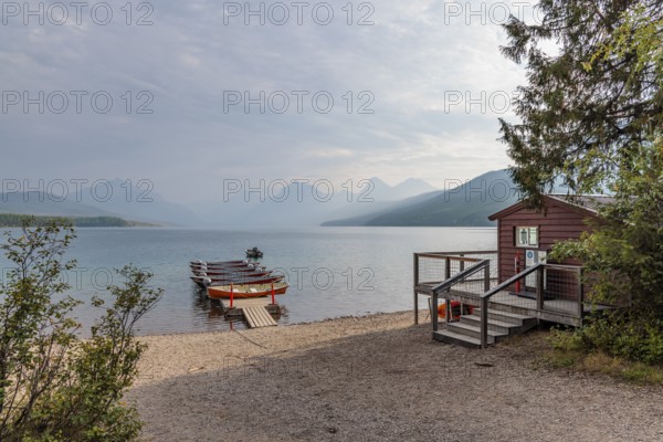240903_044 Rental boats on a floating dock along the Lake McDonald shoreline at Apgar Village in Glacier National Park, Montana, USA